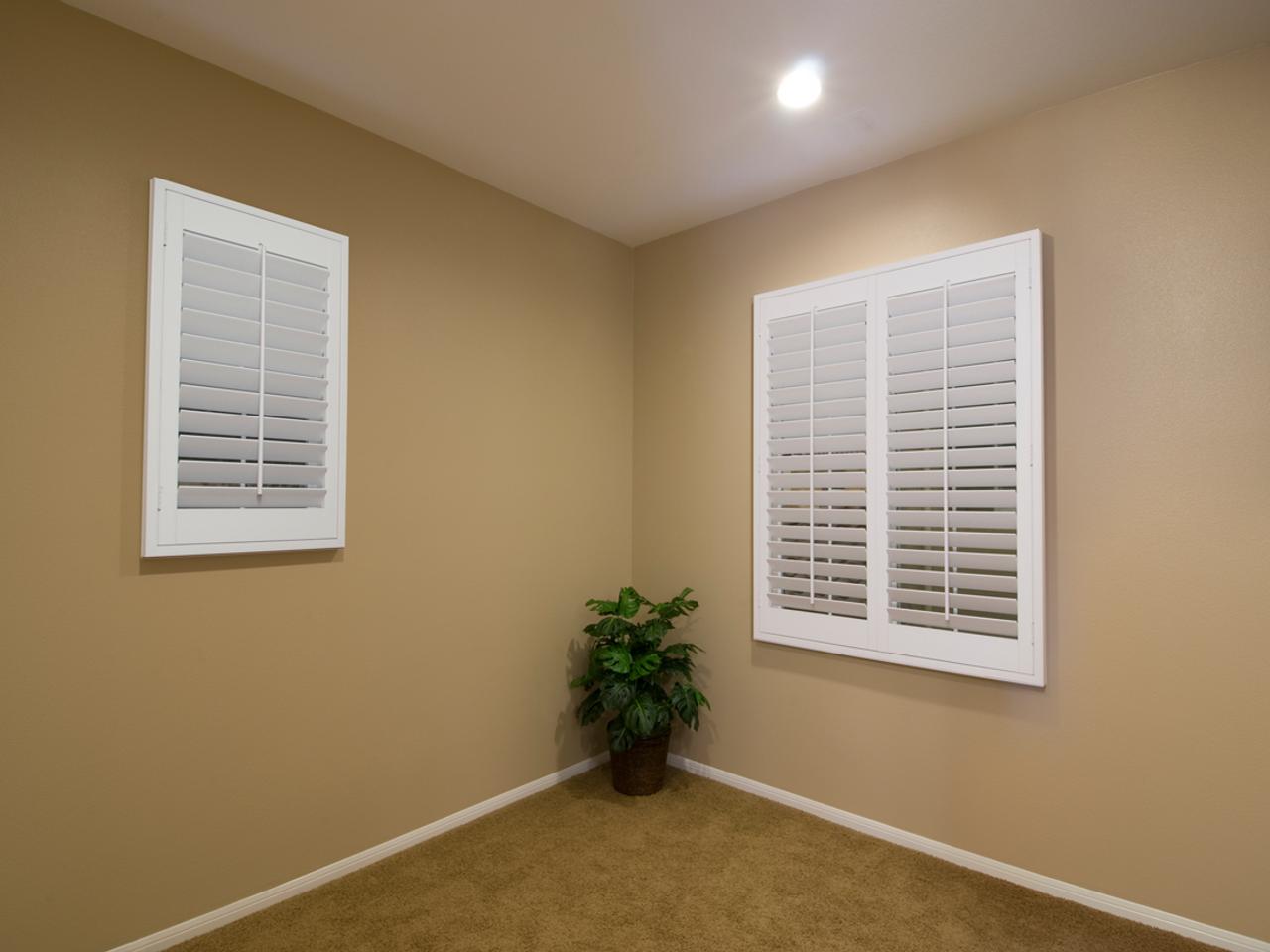 Tilted plantation shutters with and without divider rail
