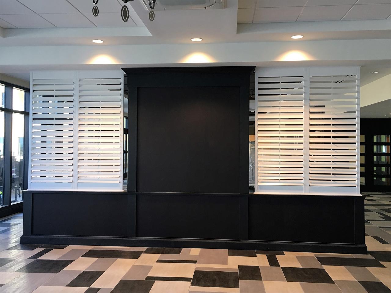 Louvered shutters on a kiosk in a hotel