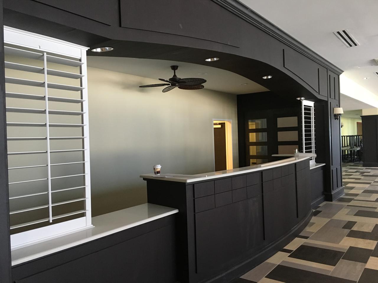Hotel front desk with louvered shutters
