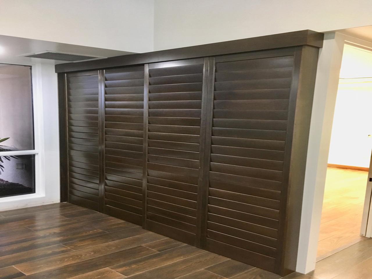 Stained Heritage shutters used as a divider