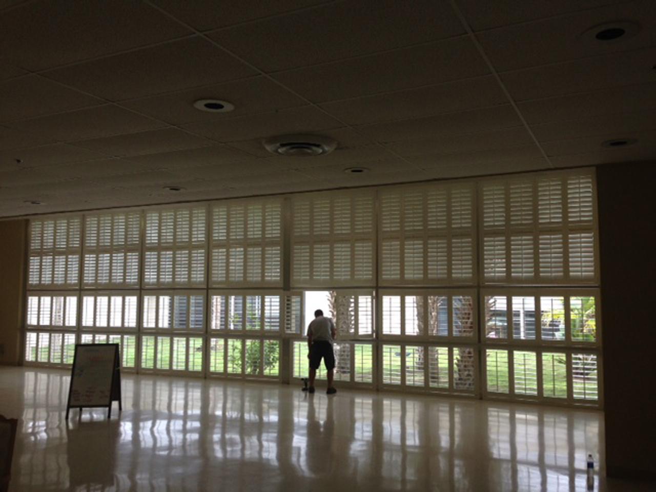 Large wall of windows with interior shutters