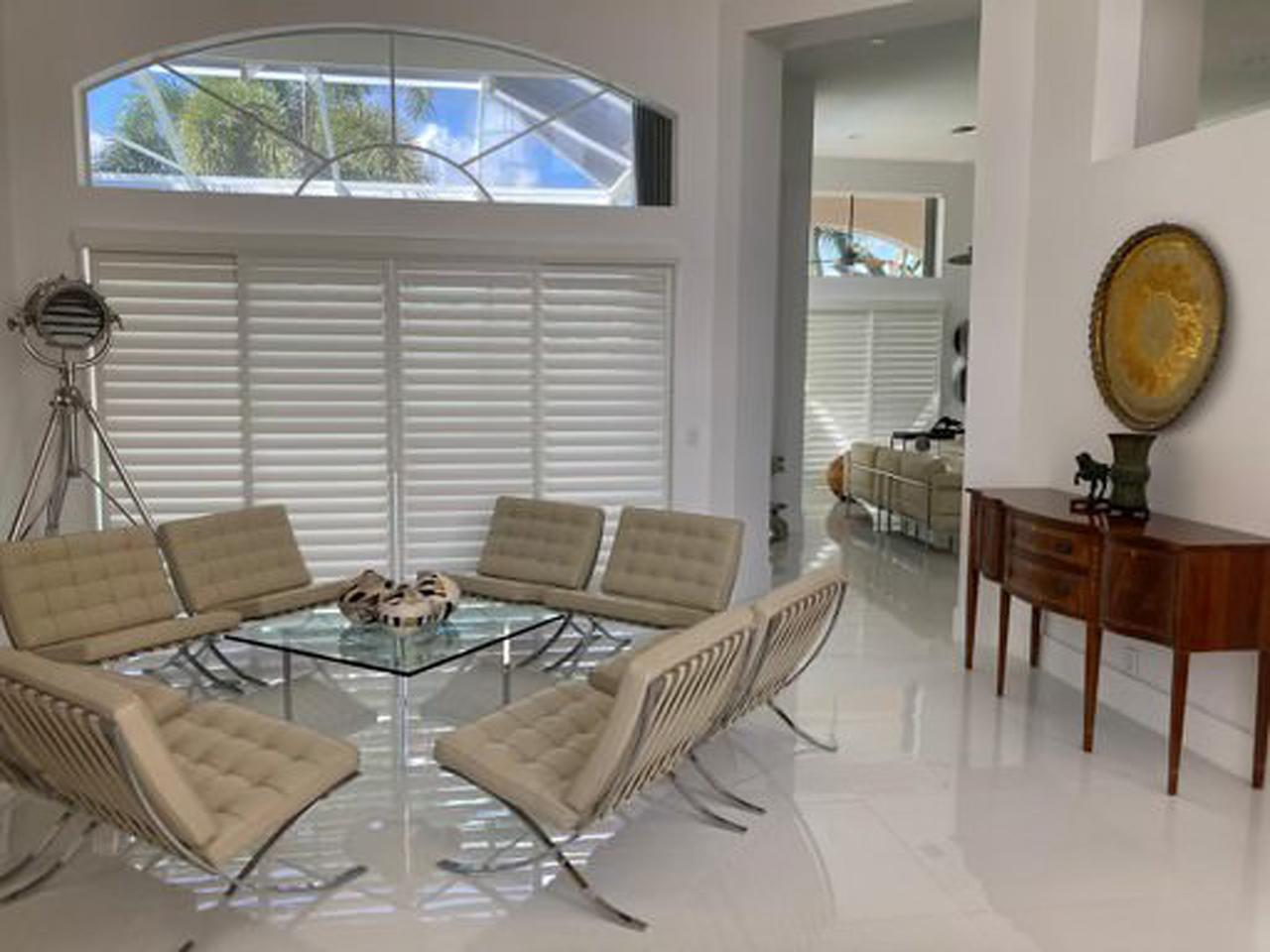 Dining area with bypass shutters on sliding glass doors