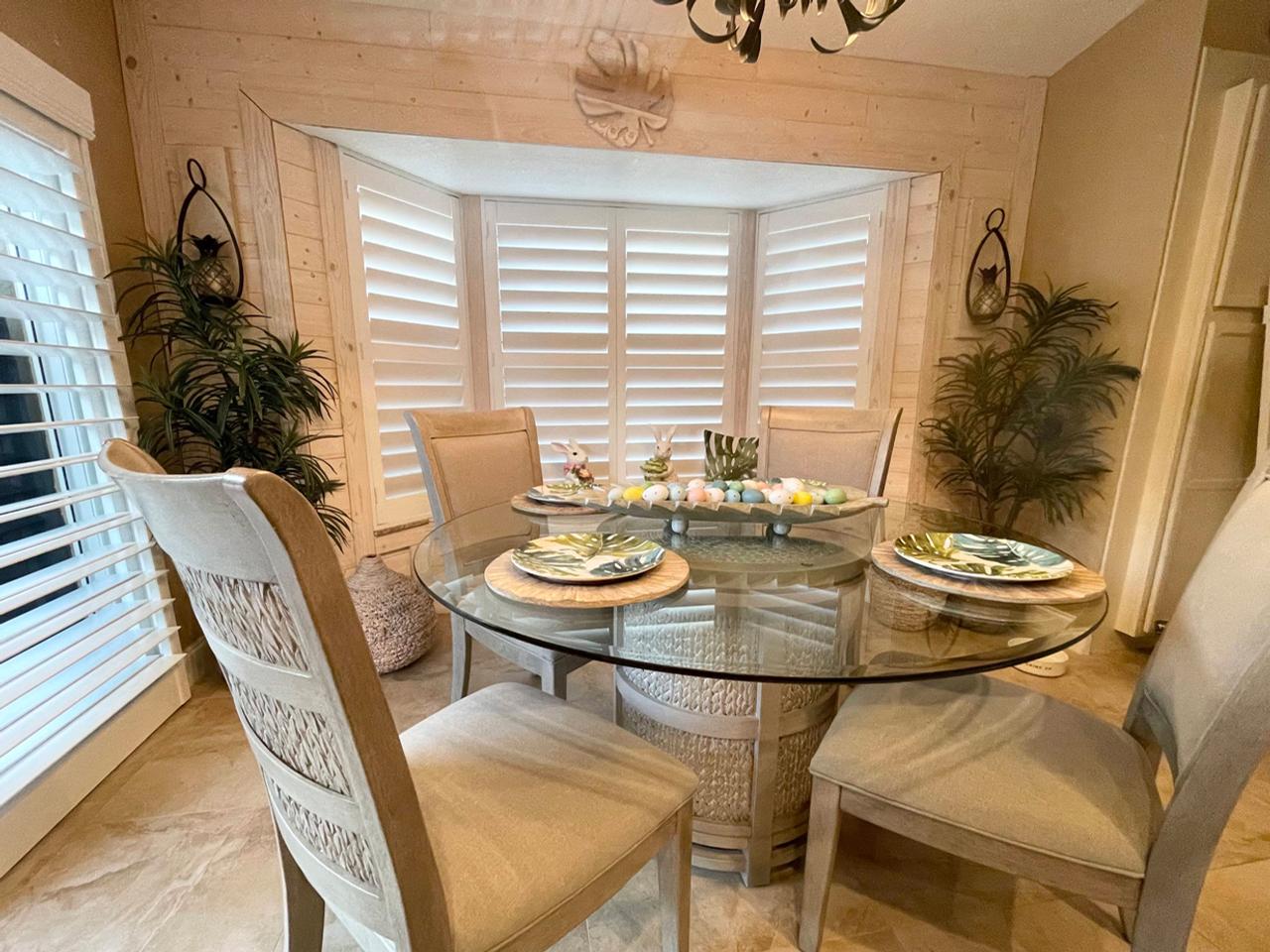 Bay window with shutters in dining room