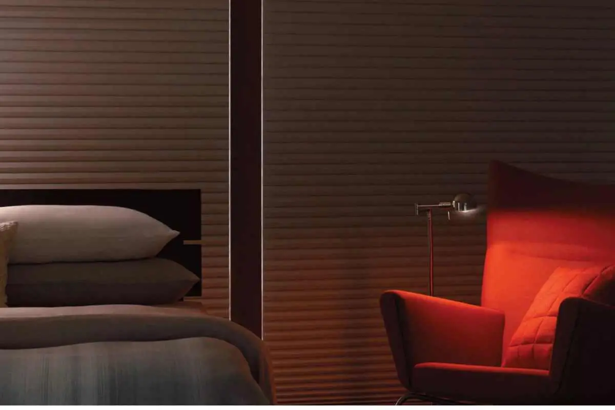 Duette blackout honeycomb shades in a bedroom