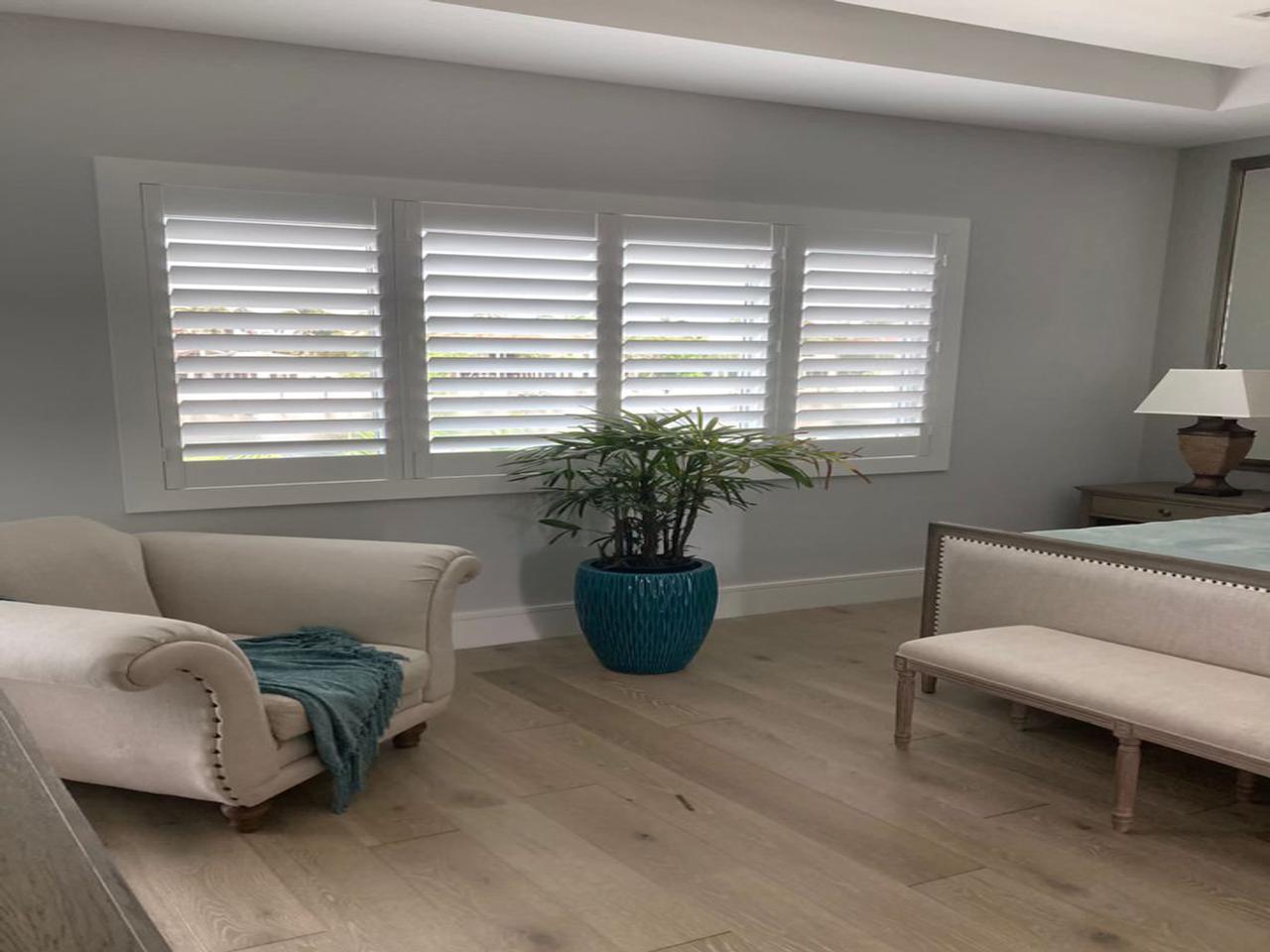 Bedroom with interior shutters