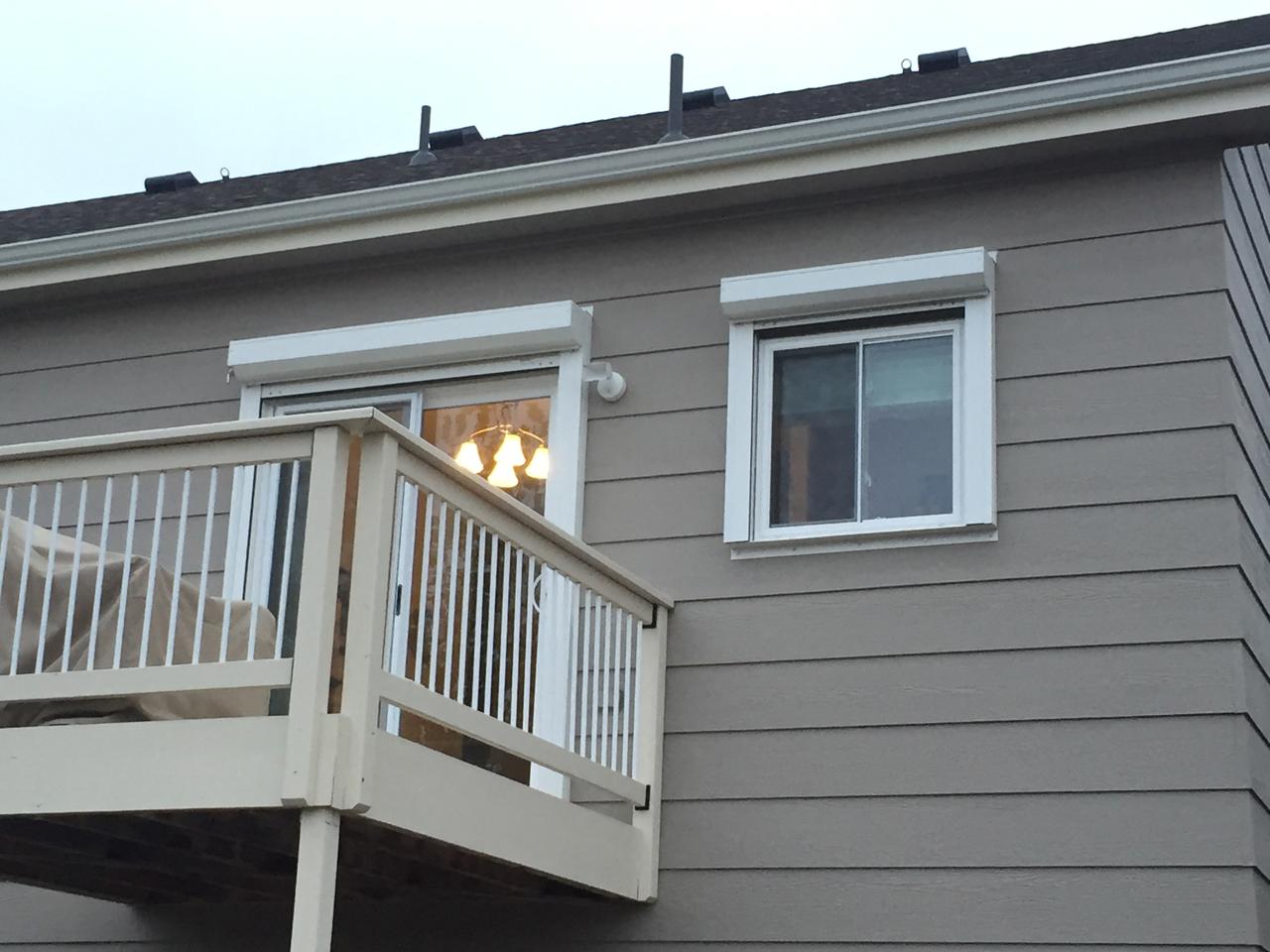 Hurricane shutters on sliding glass door and window