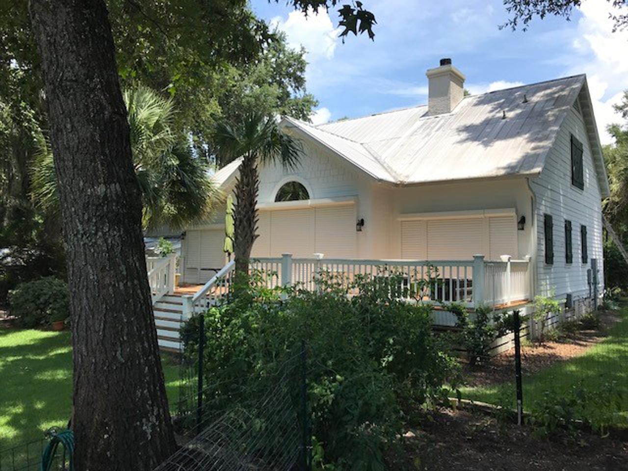 Lowered hurricane shutters on a house