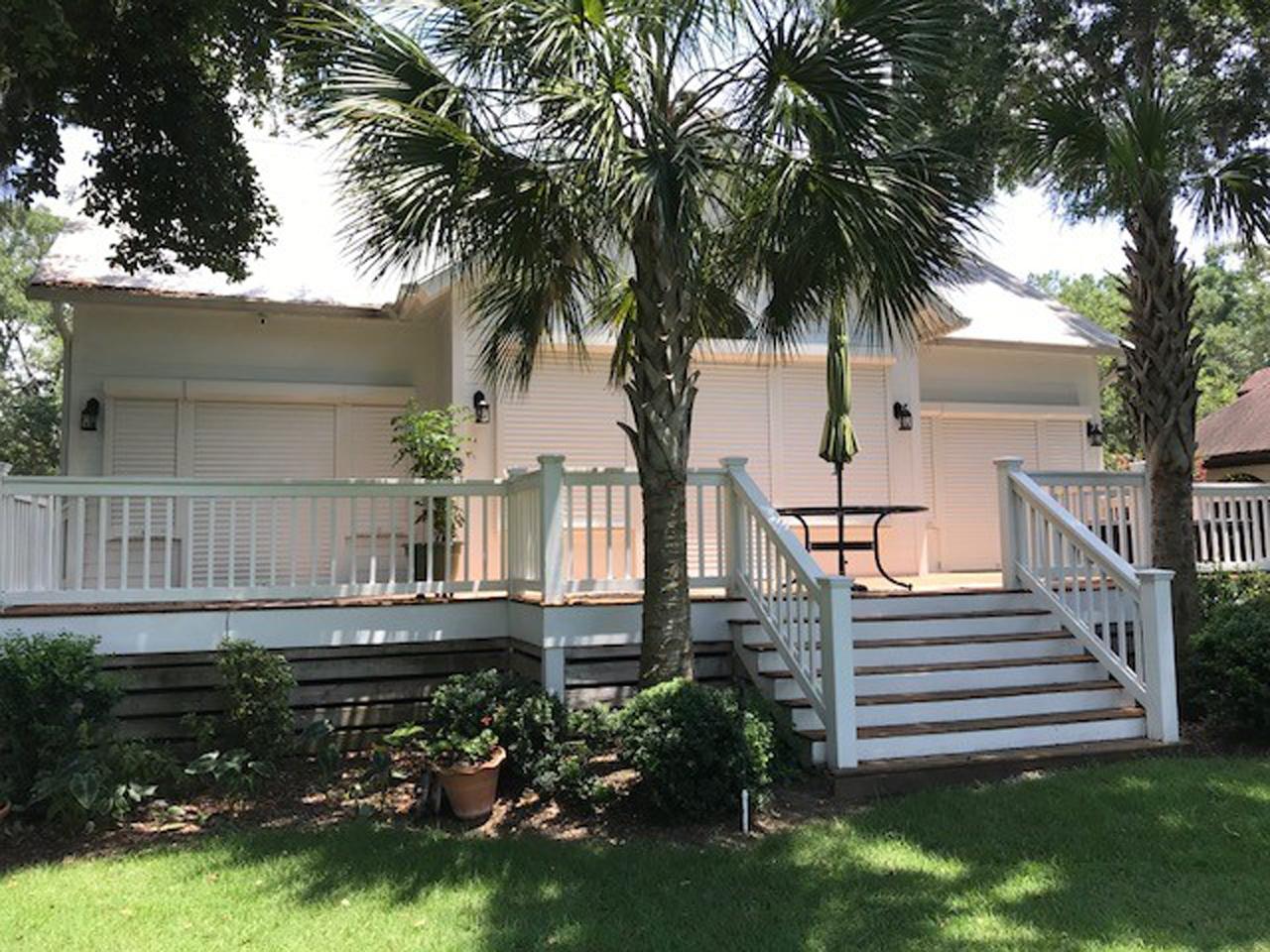 Back of house with hurricane shutters lowered