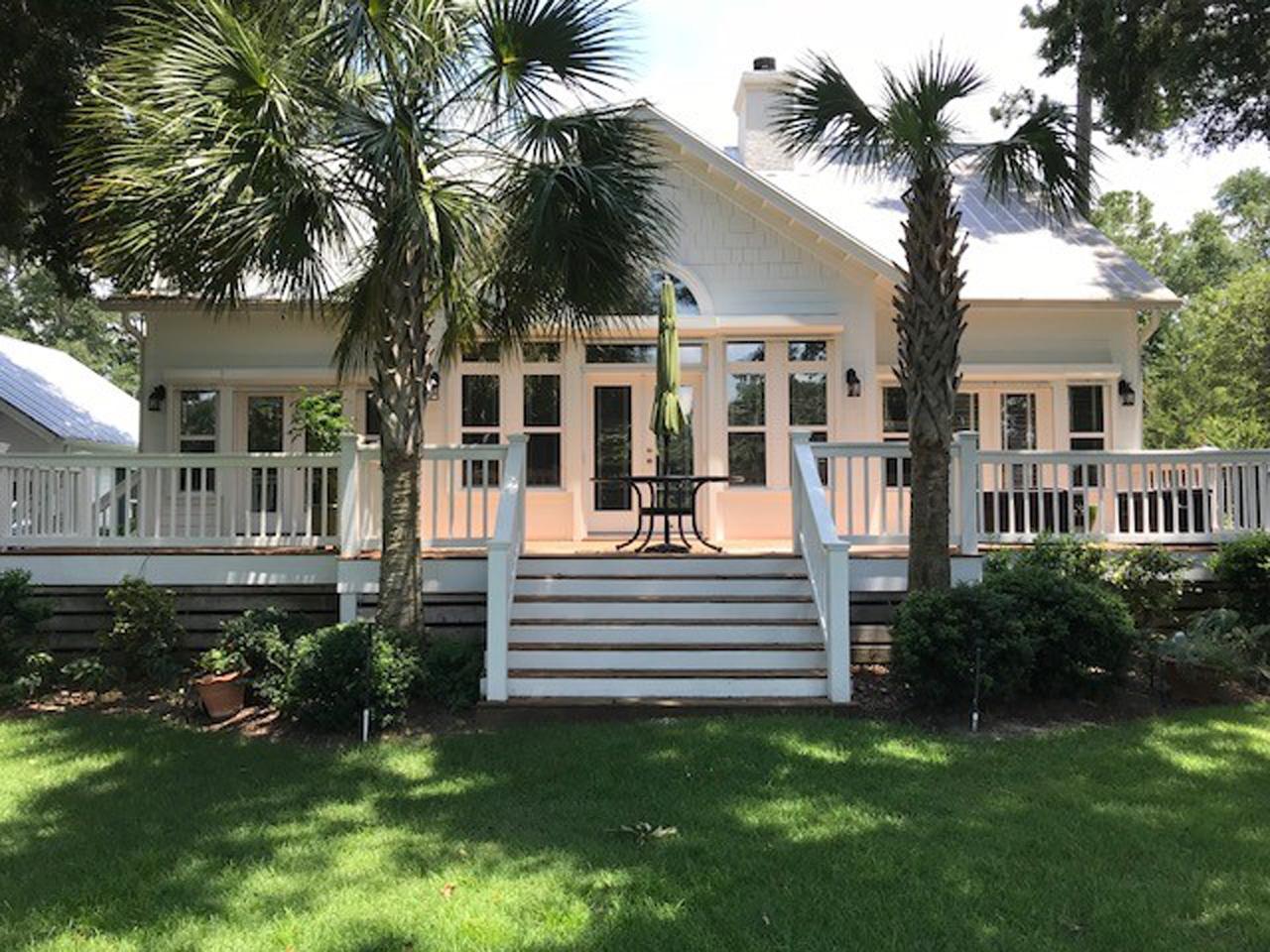 Raised hurricane shutters on back of a house