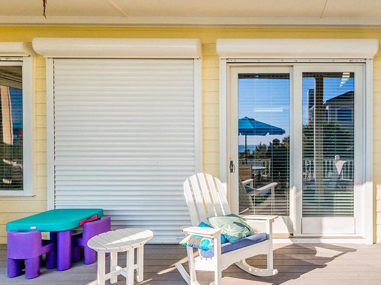 Rolling hurricane shutters on a beach home