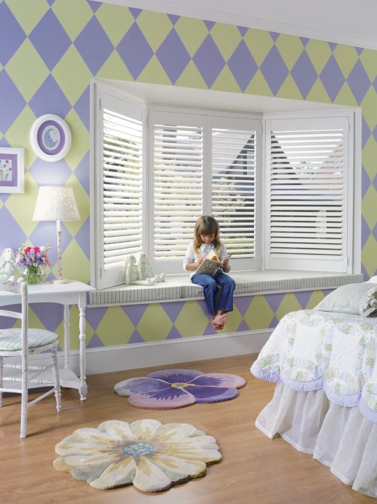 Heritance Wood Shutters in a young girl's bedroom