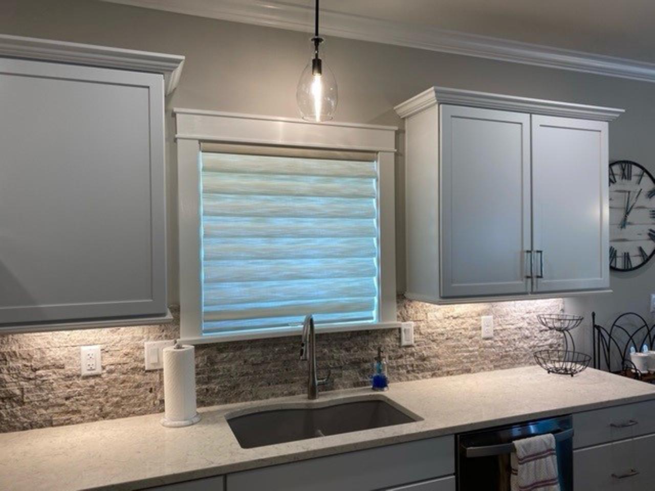 Roman shades over kitchen window