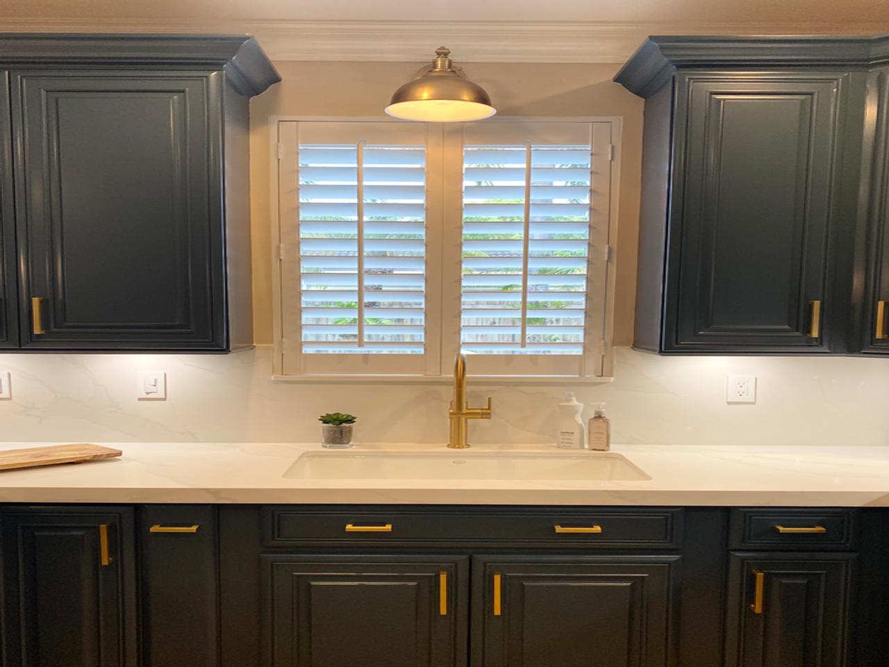 Shutters on kitchen window over sink