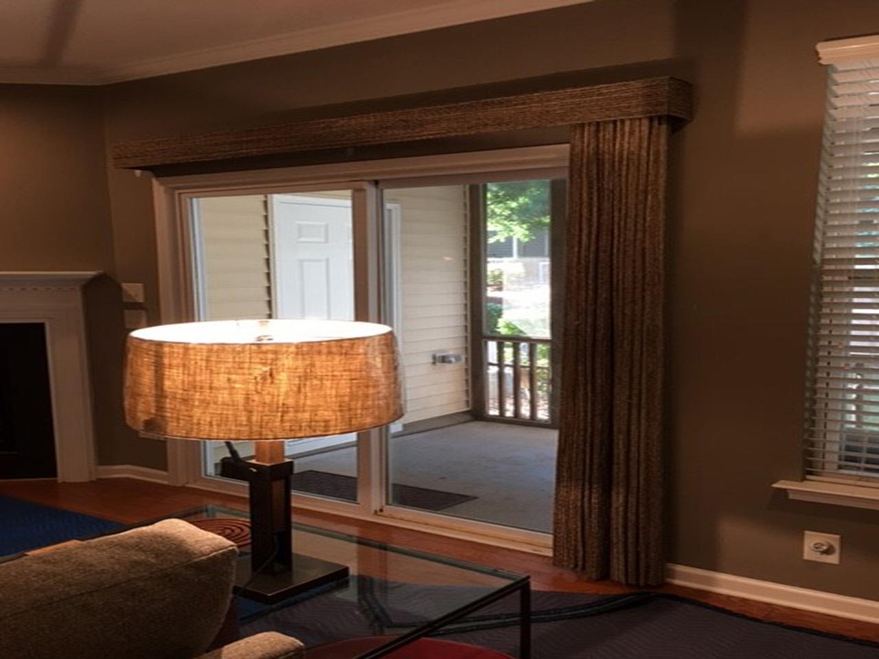 Vertical woven wood shades on sliding glass door