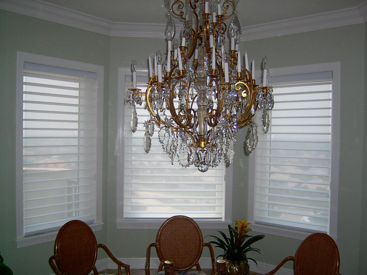 Silhouette shades on bay window in dining room