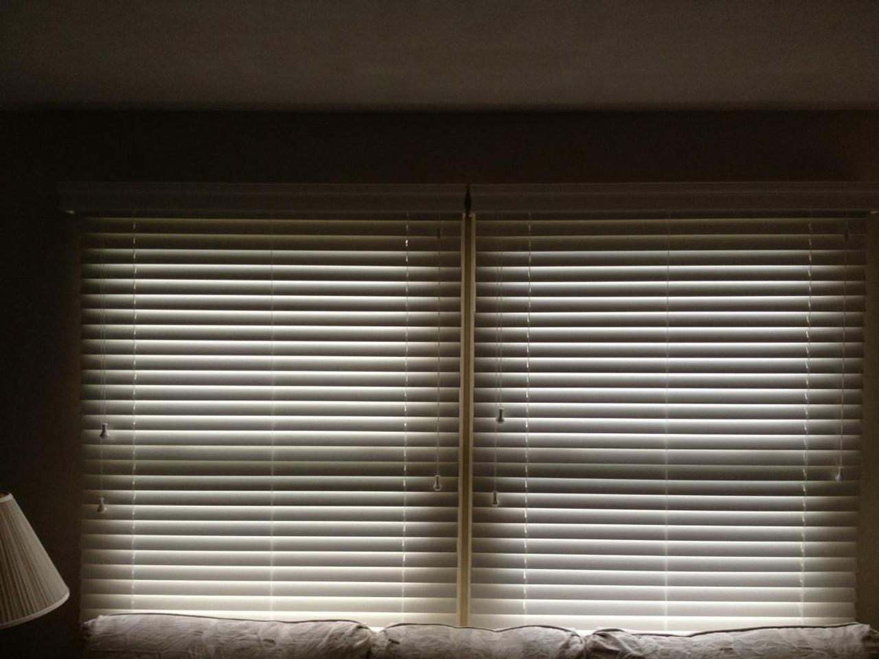 Fauxwood blinds on a double window