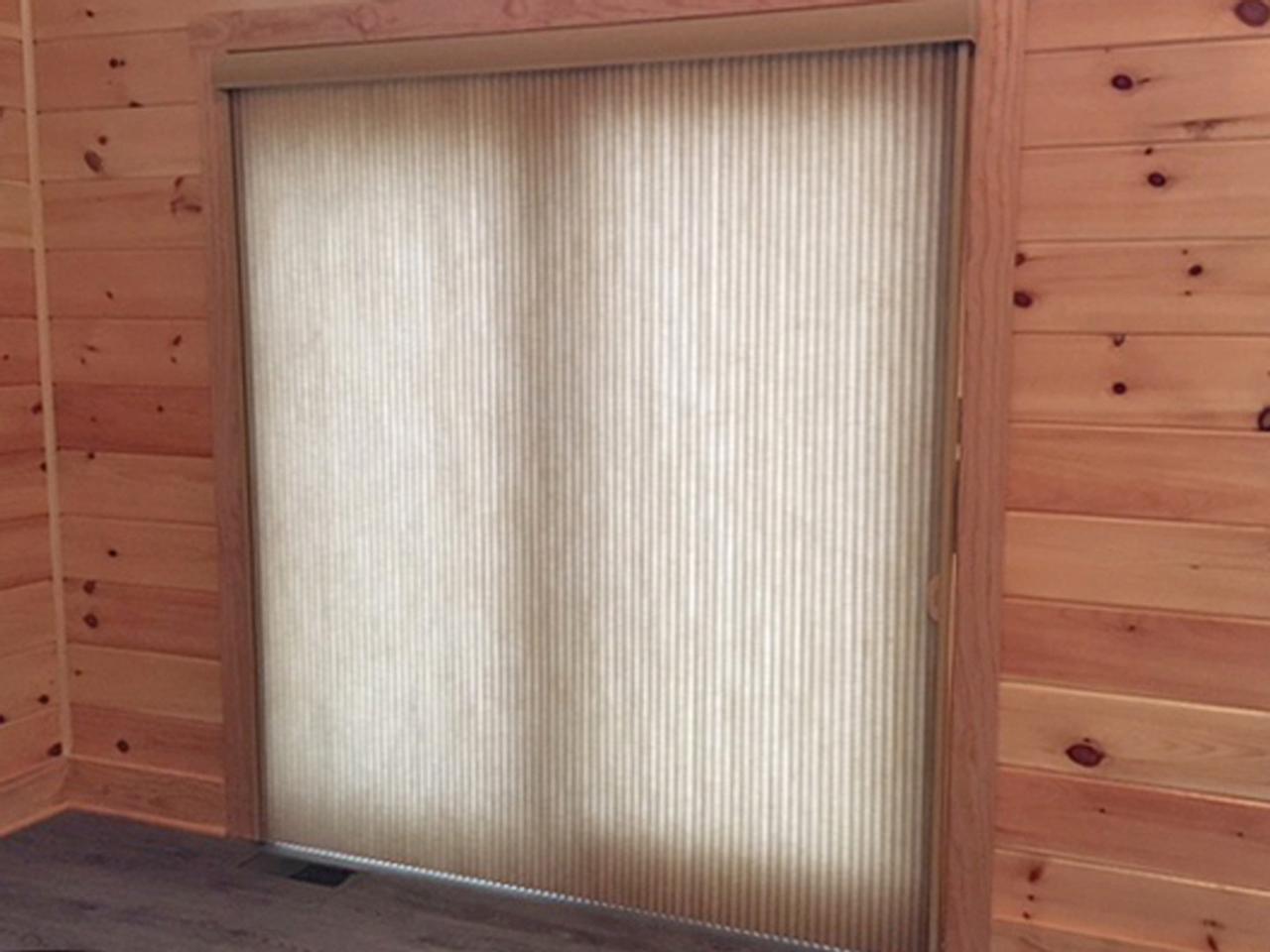 Woven wood vertical shades on sliding glass door