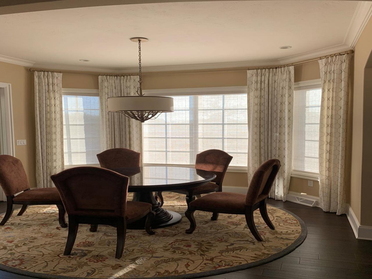 Screen shades and drapes in dining room