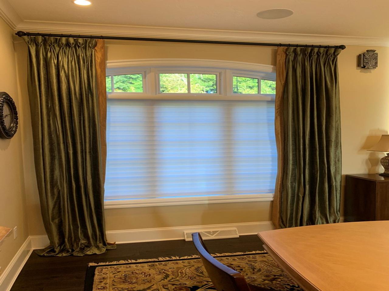 Blinds and drapes on dining room window