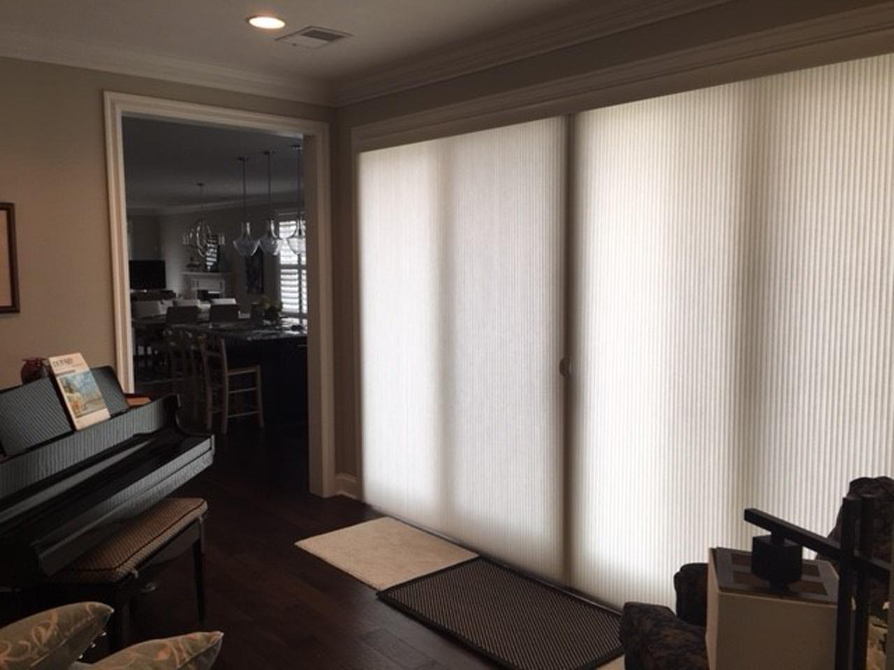 Vertical honeycomb shades on sliding glass door