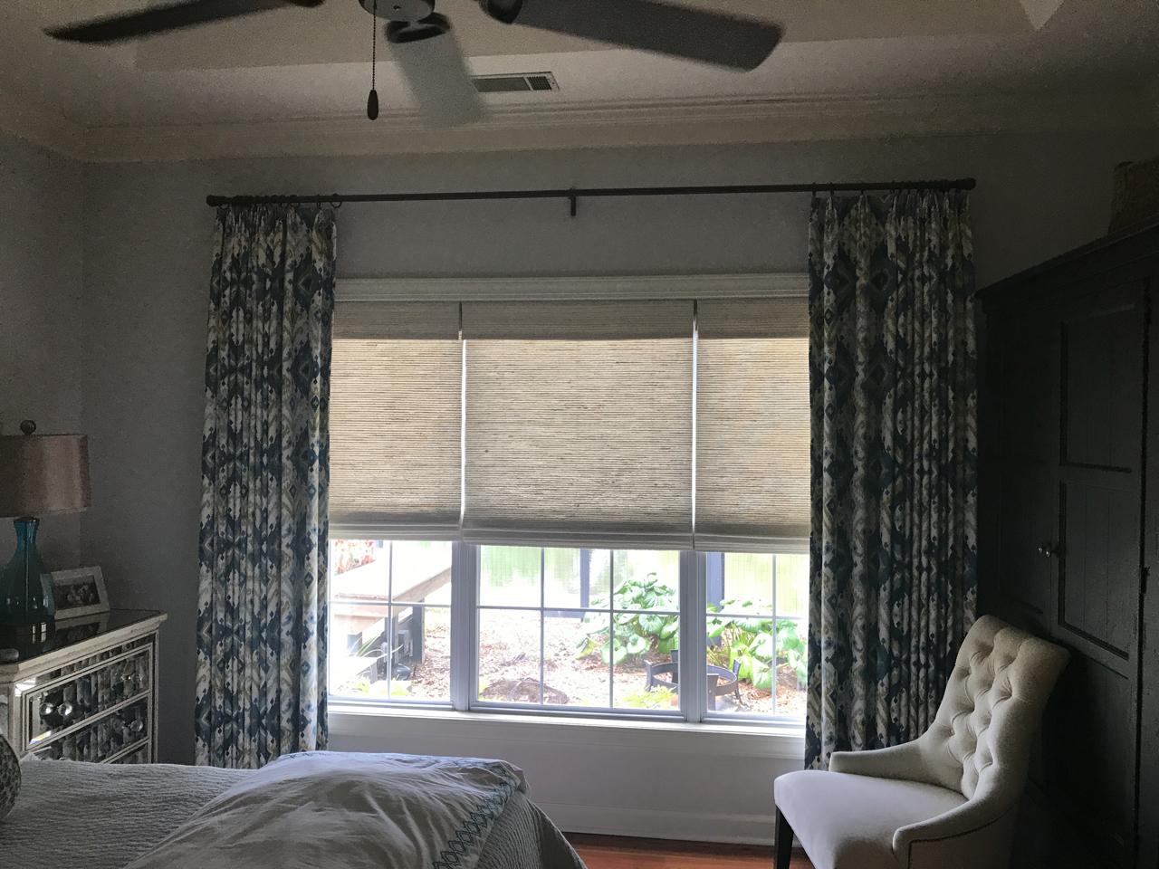 Woven wood shades in a bedroom