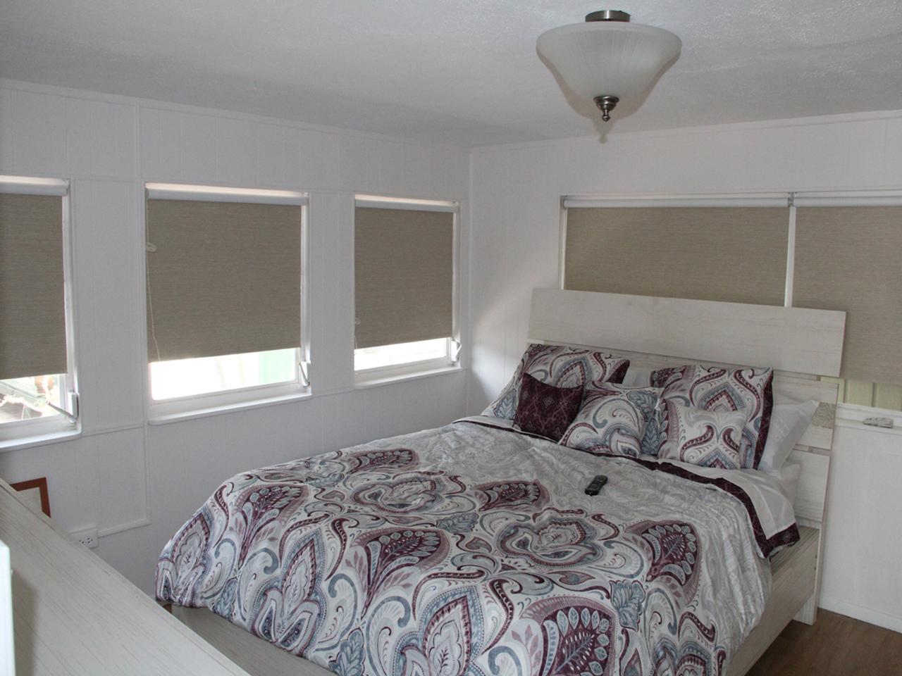 Roller shades in a bedroom