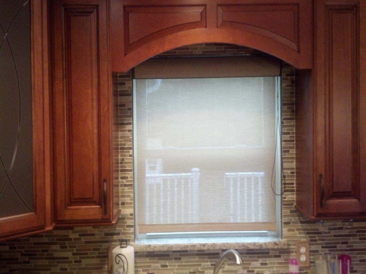 Screen shades over a kitchen window