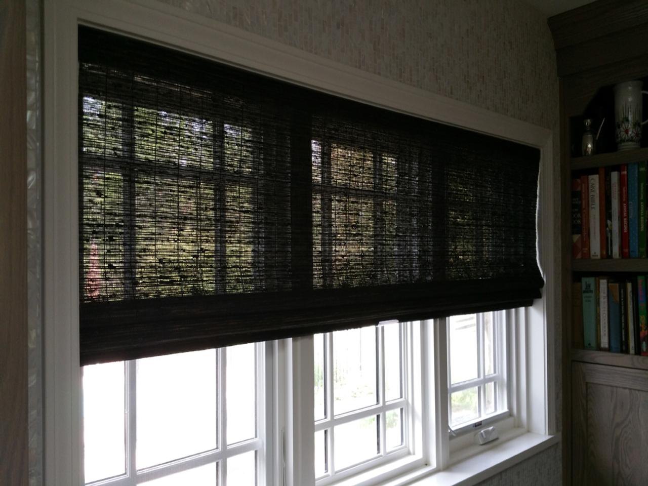 Woven wood shades in a bedroom