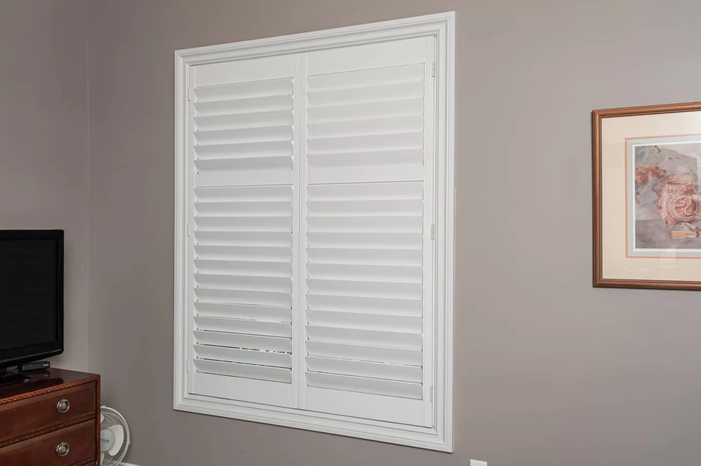 wood plantation shutters on a bedroom window