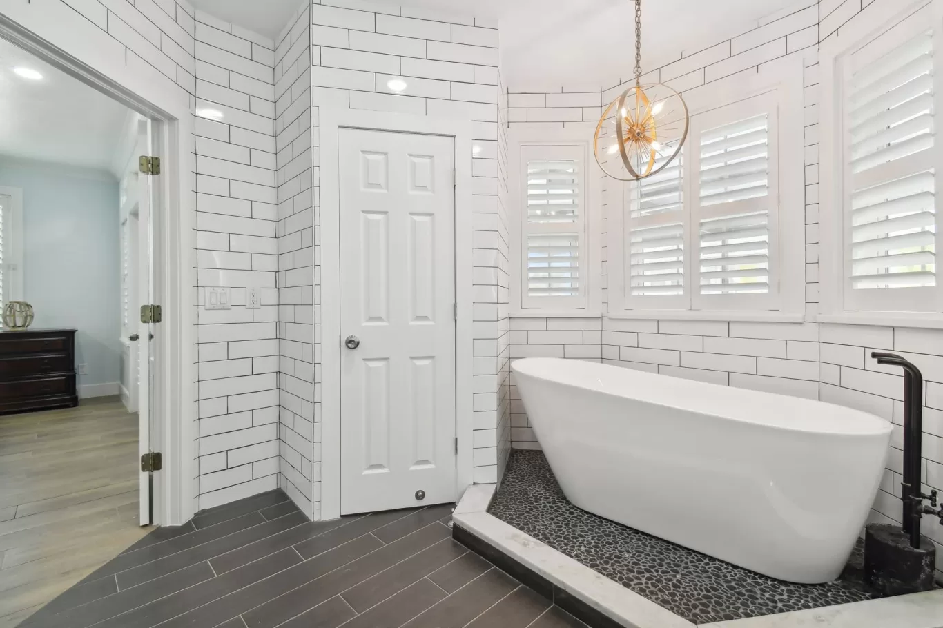 LouverWood Shutters installation on bay windows in a bathroom