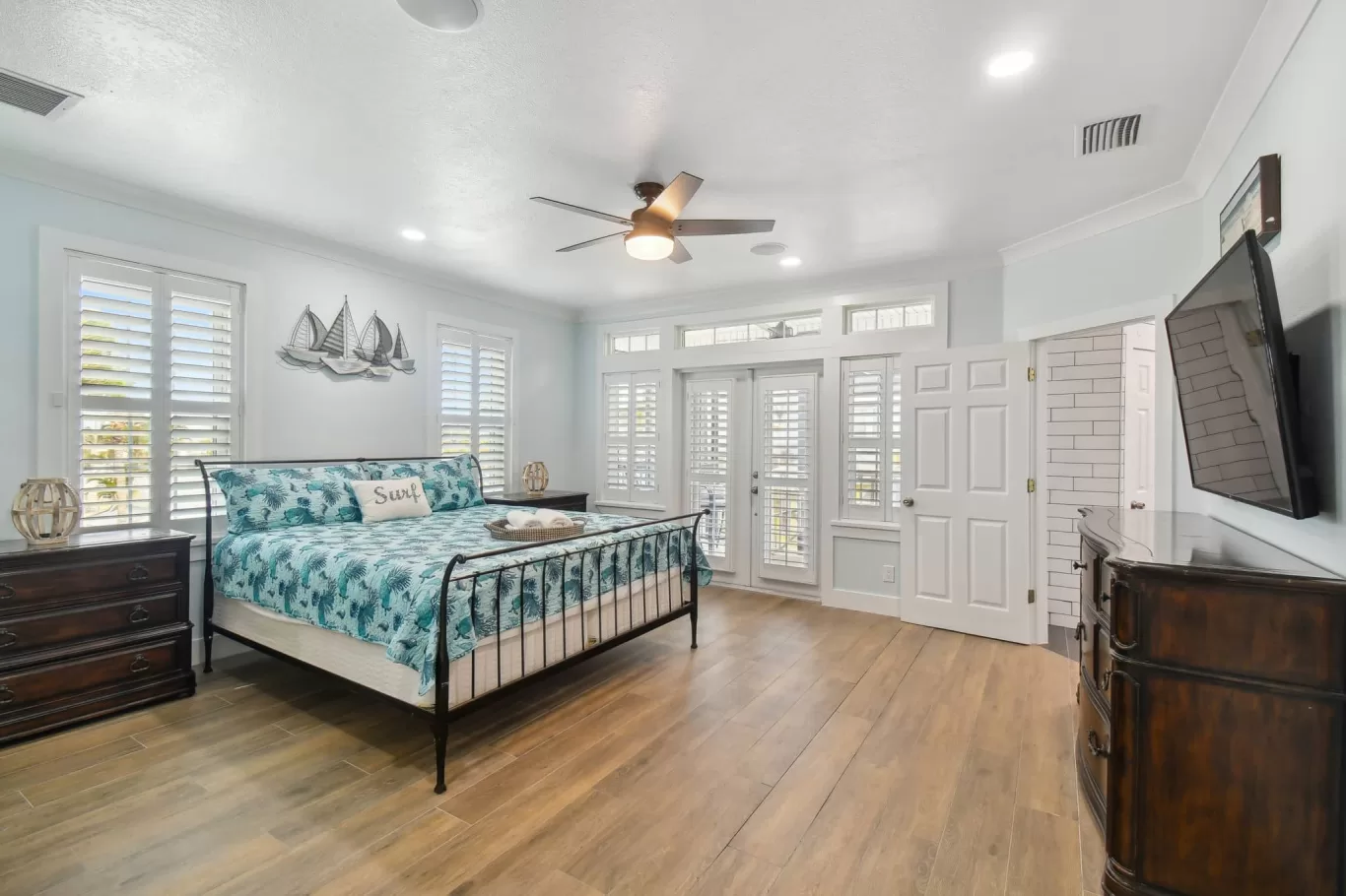 LouverWood Shutters on windows and French doors - Bedroom