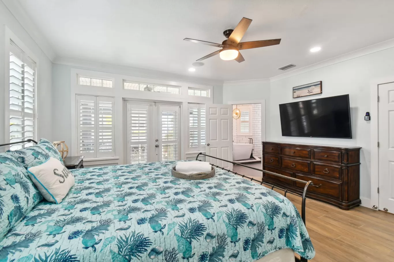 LouverWood Shutters on windows and French doors - Bedroom