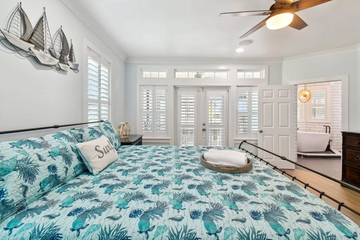 plantation shutters on French doors in a bedroom