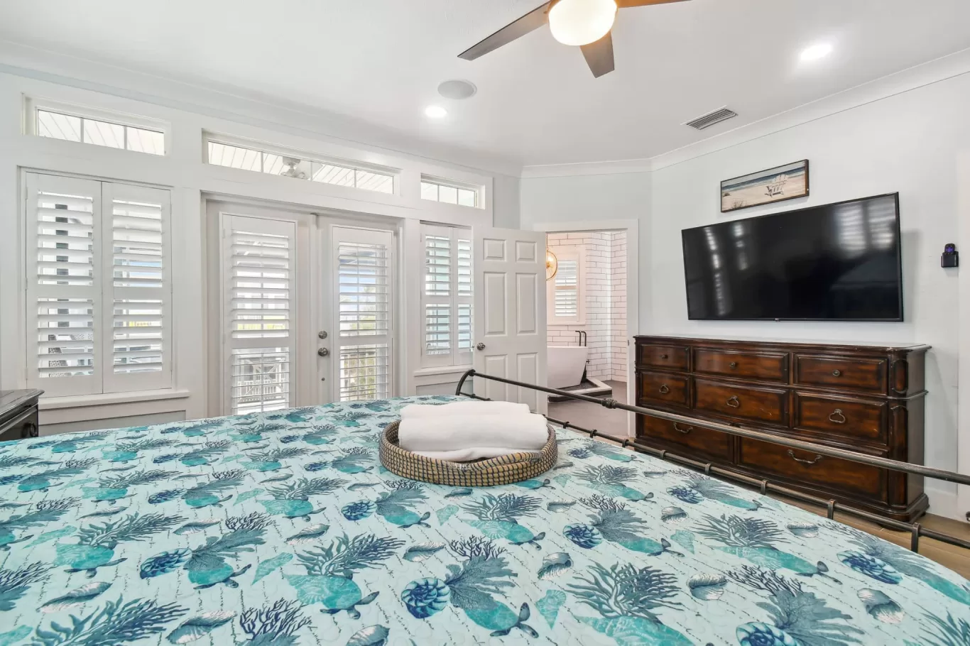 LouverWood Shutters installation on windows and French doors in bedroom