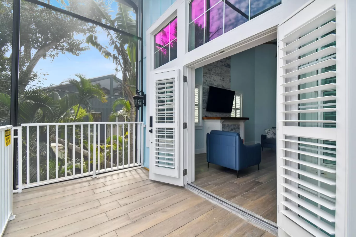 view from outside of LouverWood plantation shutters on French doors