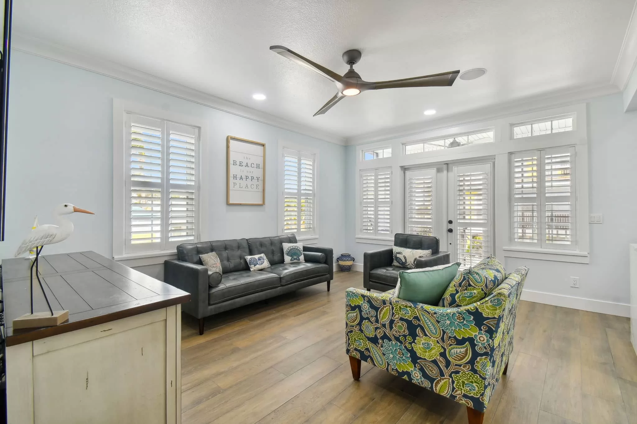 LouverWood Shutters on French doors in a living room