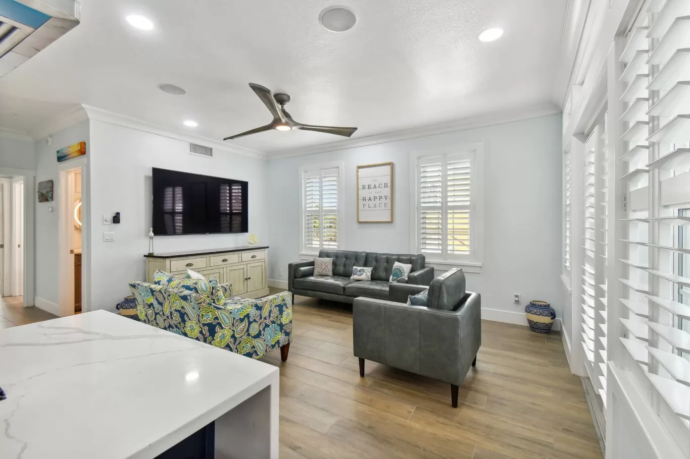 LouverWood Shutters in a kitchen/sitting room with French doors