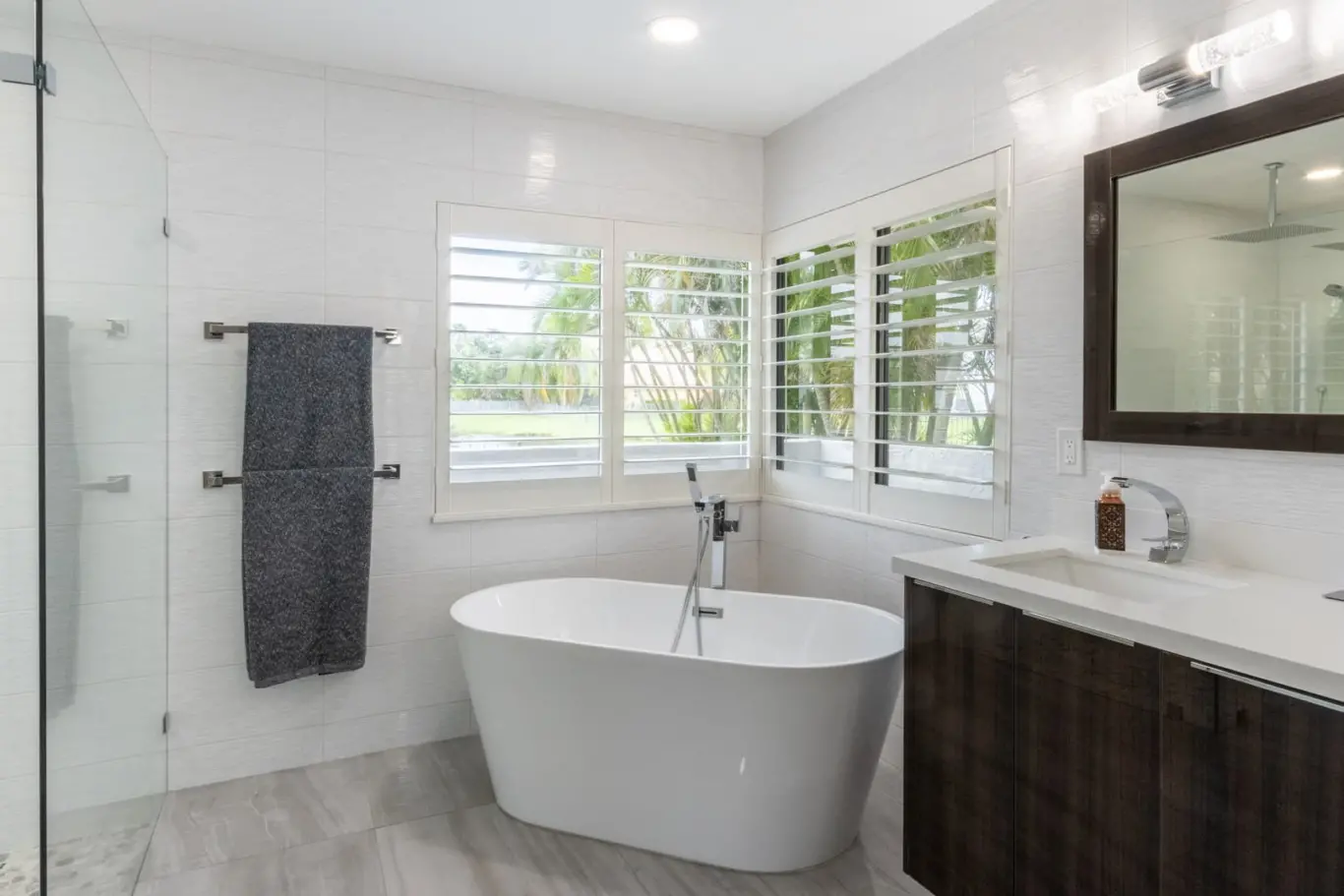 plantation shutters above a luxury tub