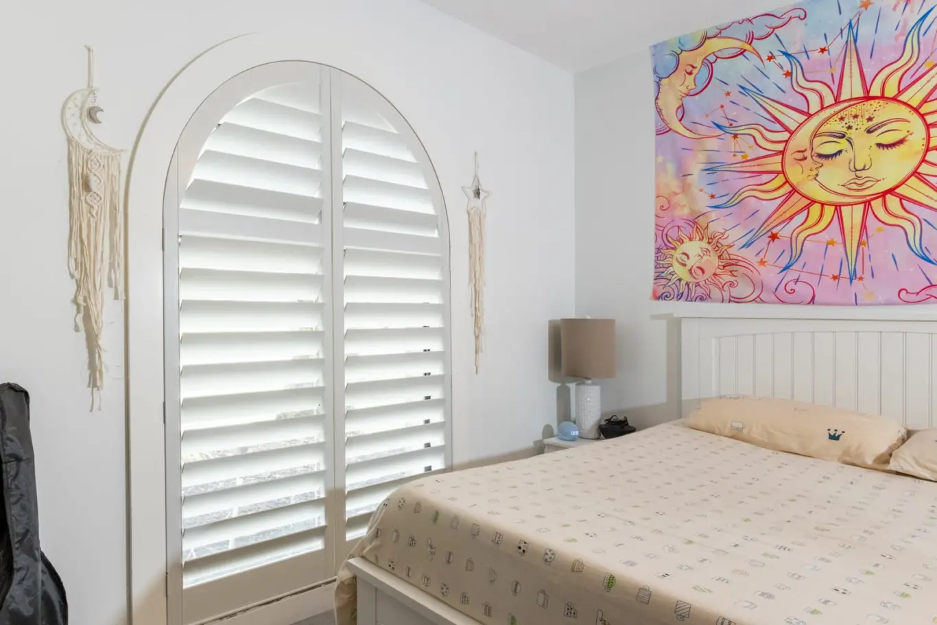 Heritage Plantation Shutters on a large arched window