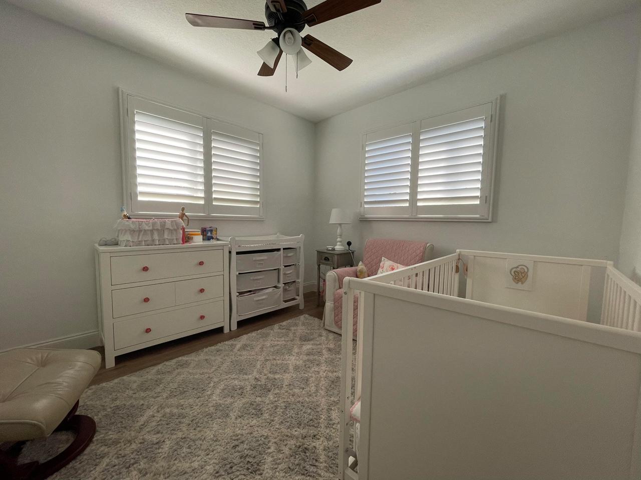 Baby's nursery with plantation shutters