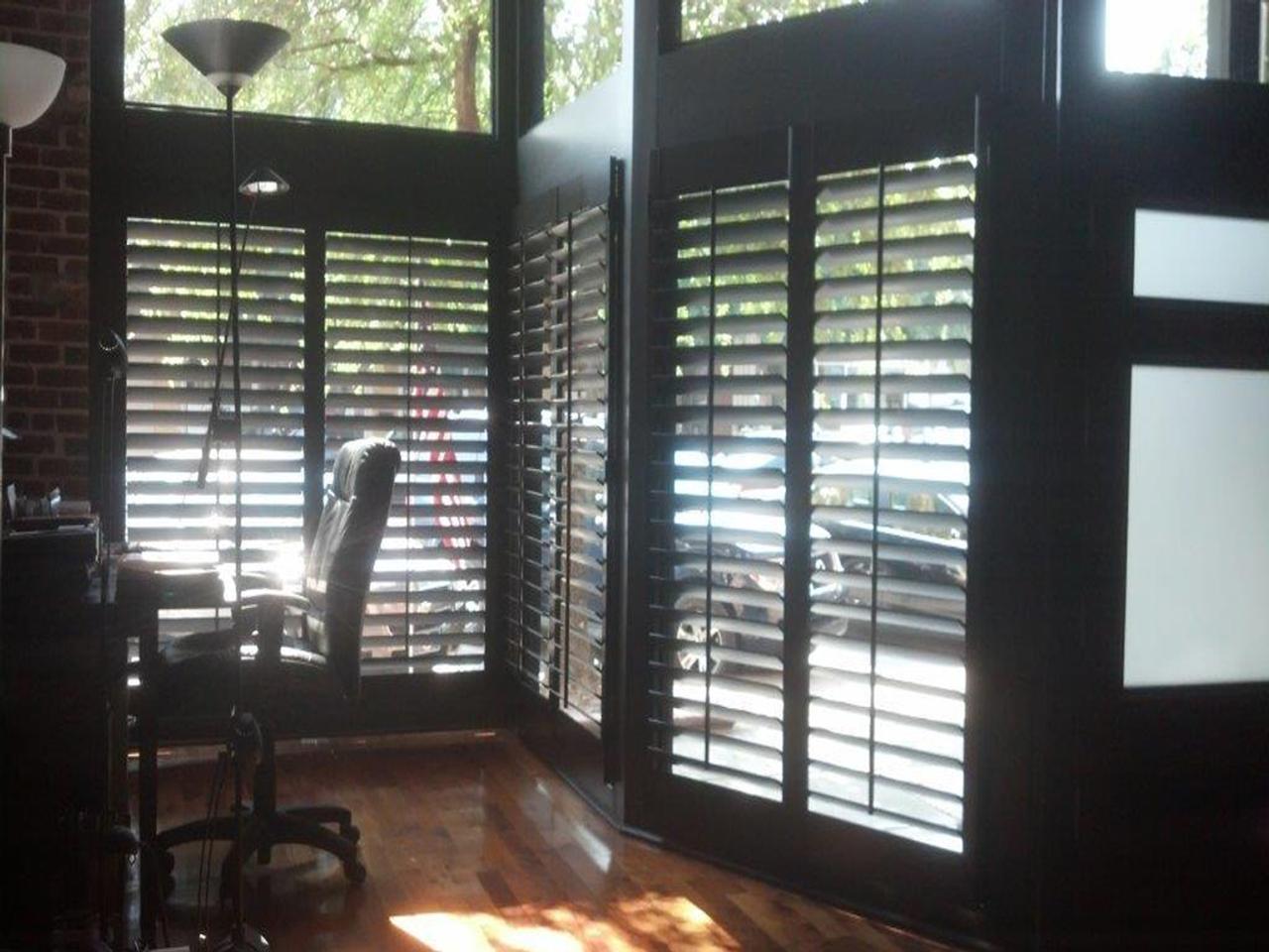 Dark stained shutters in an office