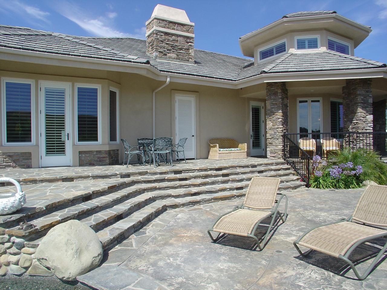 Outside view of home with plantation shutters on the French door and windows