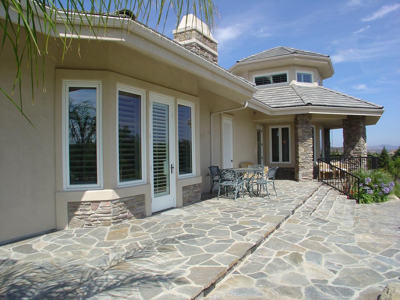 Outside view of French doors and windows with plantation shutters