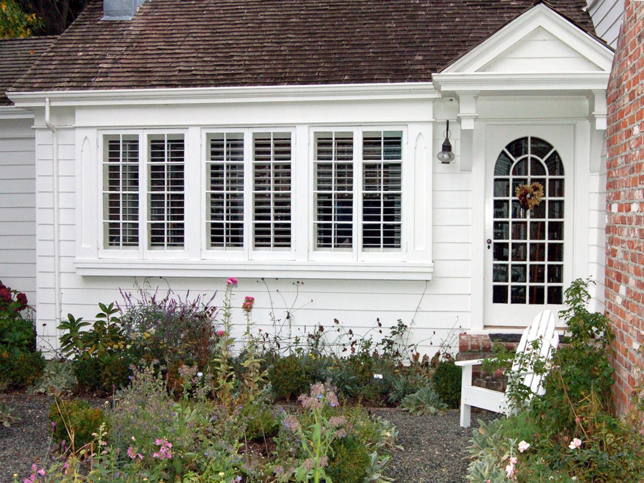 Outside view of traditional style house with plantation shutters