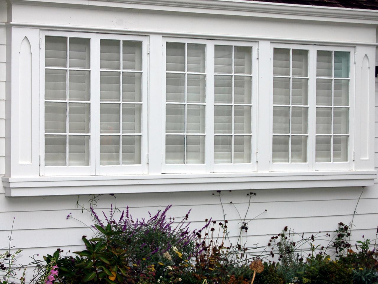 Outside view of plantation shutters on triple windows