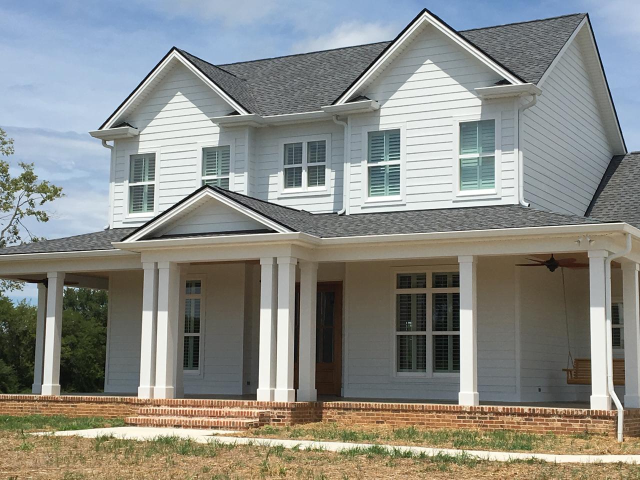 Home with view from outside of plantation shutters on the windows