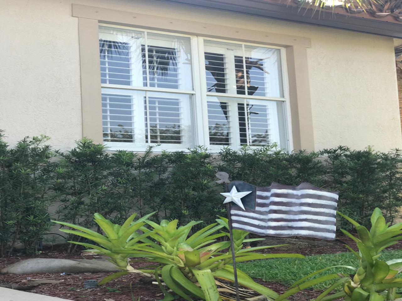 Exterior view of windows with plantation shutters