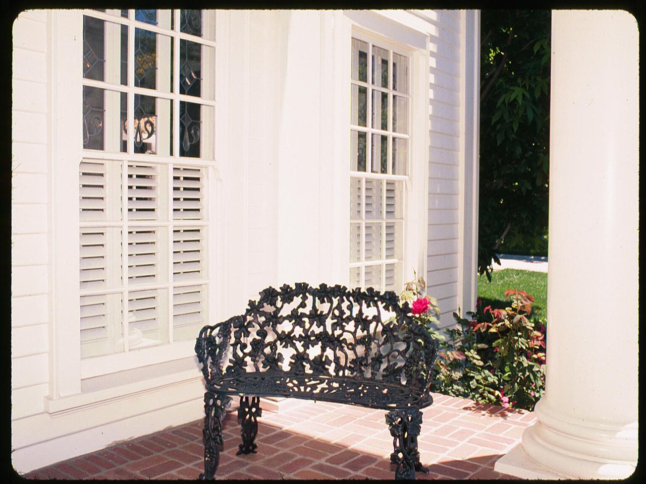 Traditional home with cafe style interior shutters