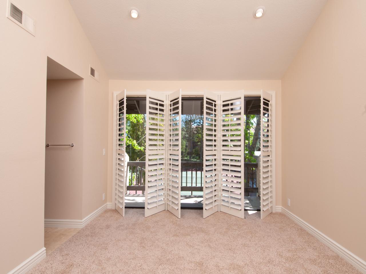 Opened shutters on sliding glass door