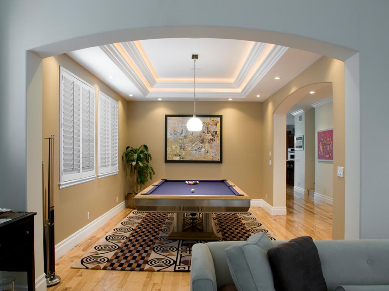 Rec room with pool table with interior shutters on the windows
